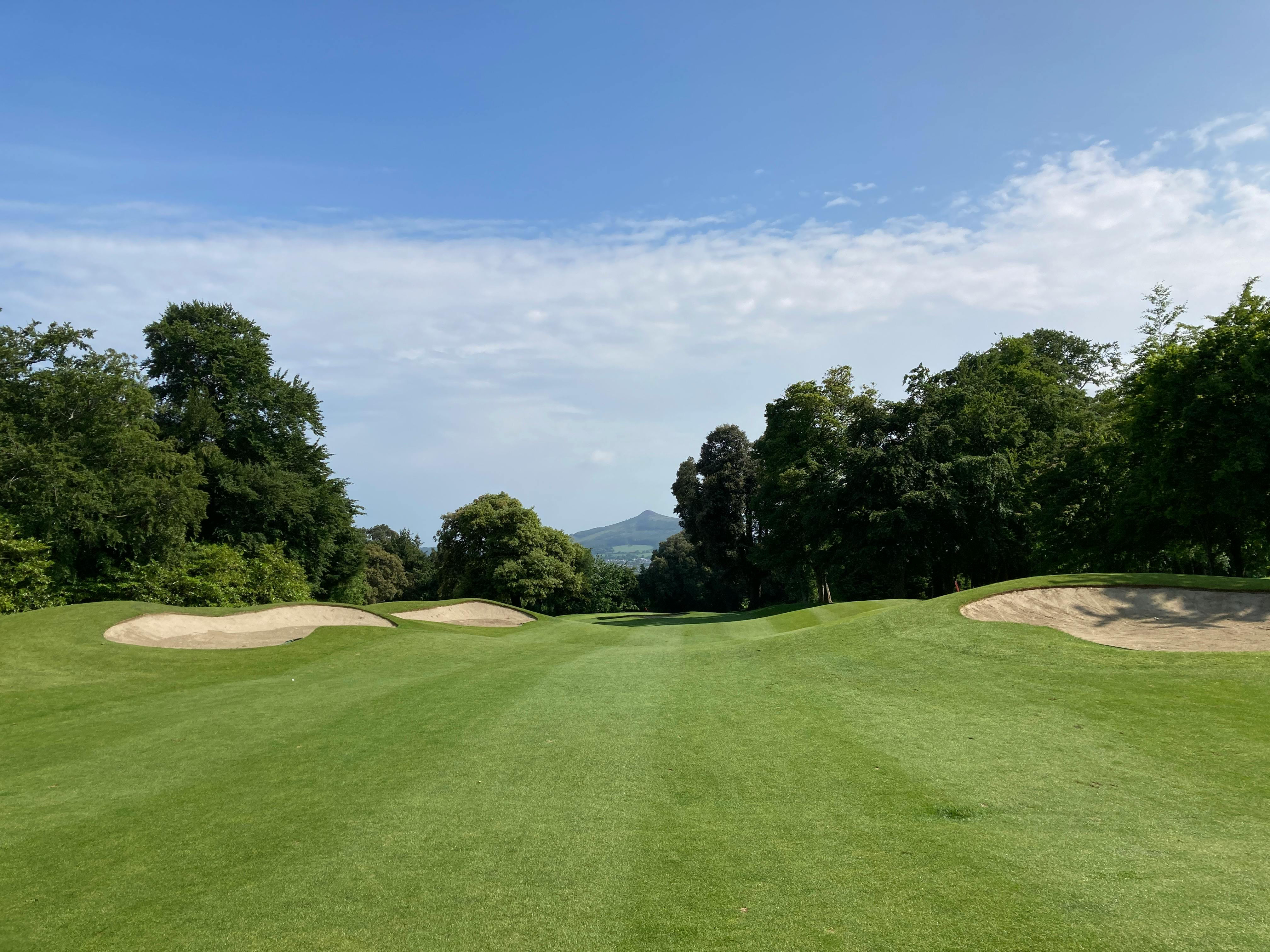 Photo of a study hall area with desks and people studying.